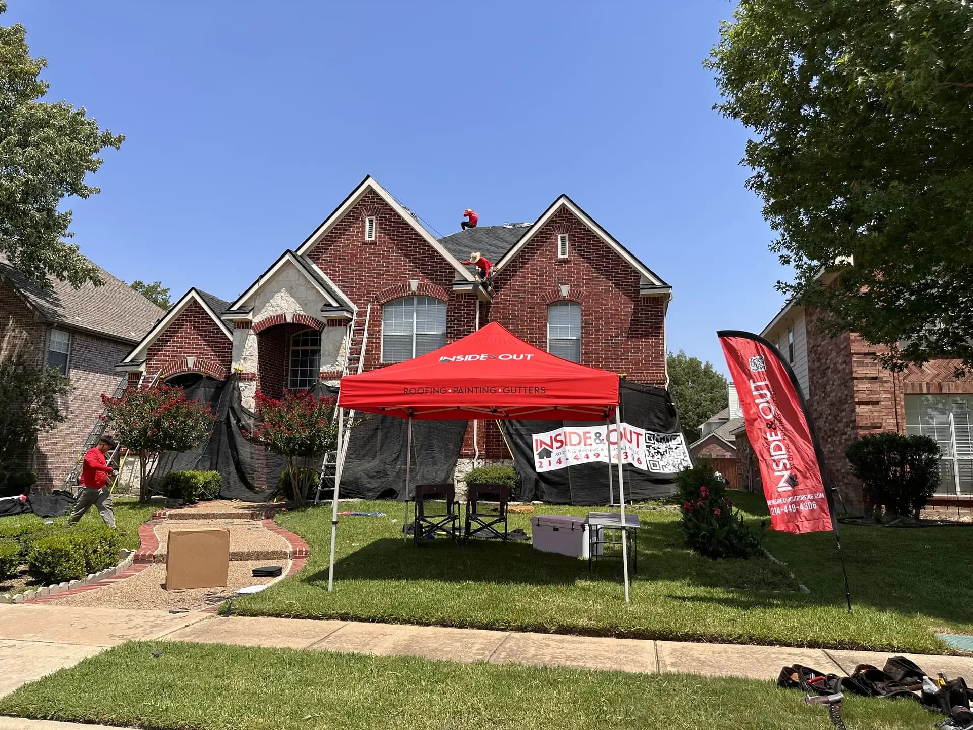 Team working in front of customer's home