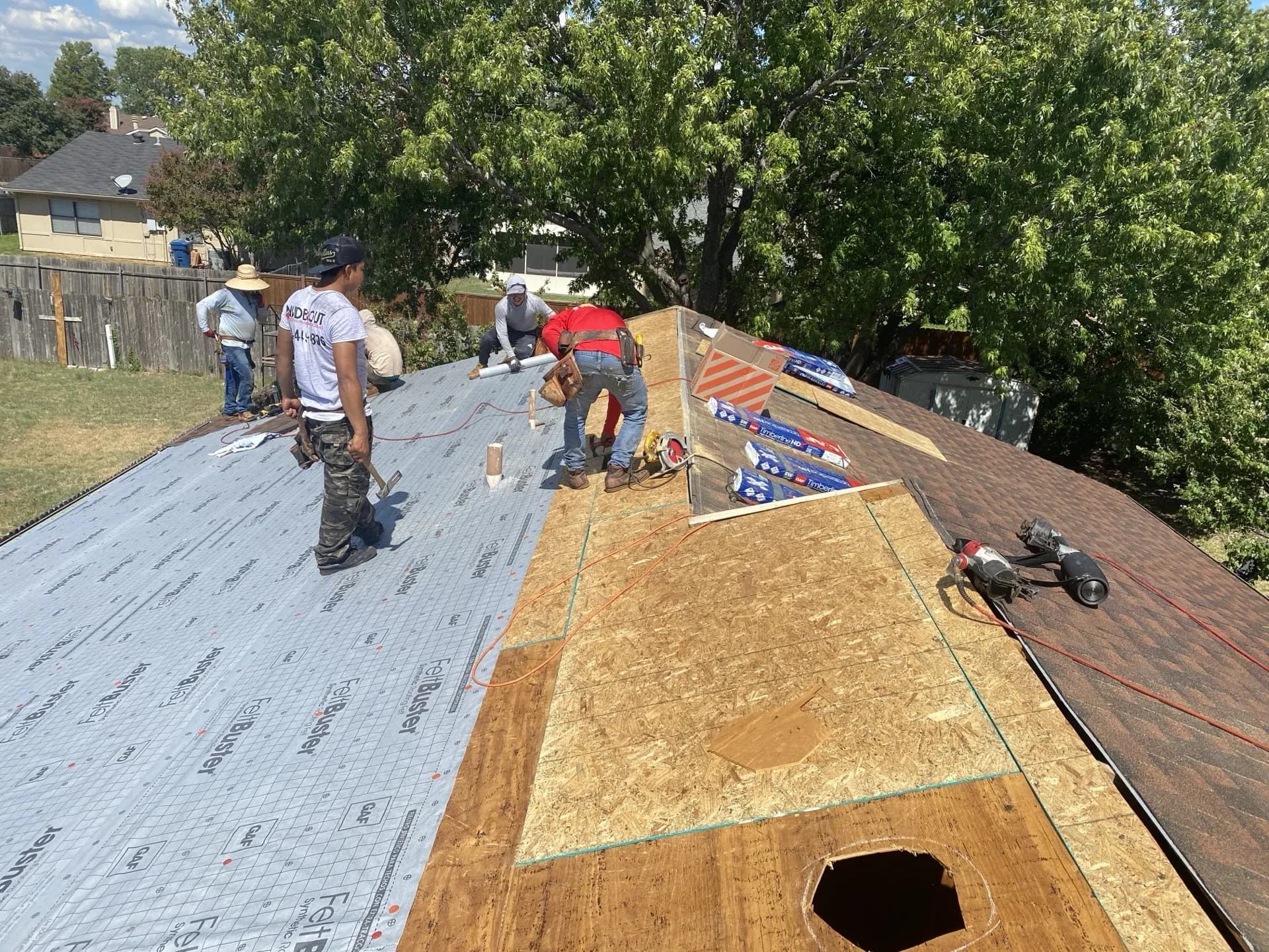 Workers fixing a roof